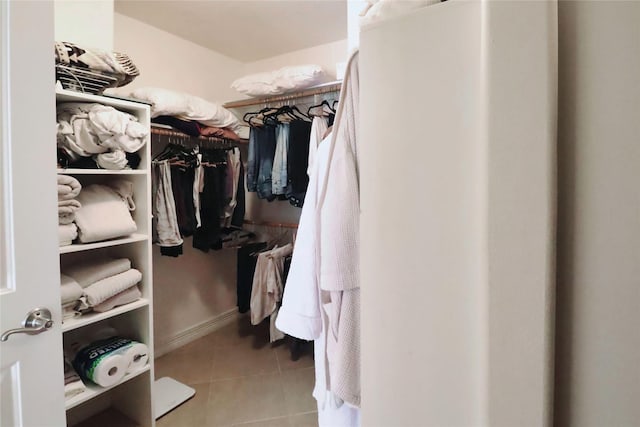 spacious closet featuring tile patterned flooring