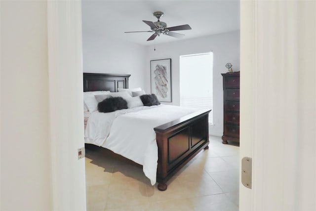 bedroom featuring light tile patterned floors and a ceiling fan