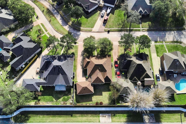 aerial view of residential area with a pool