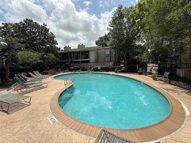 5711 Sugar Hill Dr Unit 62, Houston, TX 77057 - community pool featuring fence and a patio