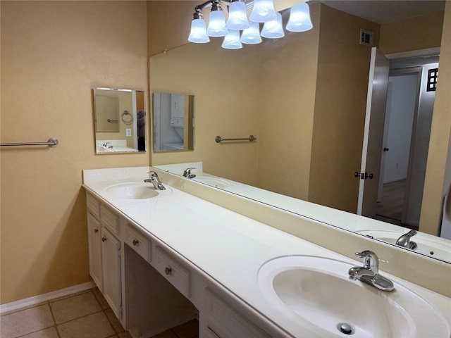 5711 Sugar Hill Dr Unit 62, Houston, TX 77057 - bathroom with baseboards, tile patterned floors, a sink, and visible vents