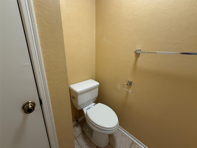 5711 Sugar Hill Dr Unit 62, Houston, TX 77057 - bathroom with tile patterned floors, baseboards, and toilet
