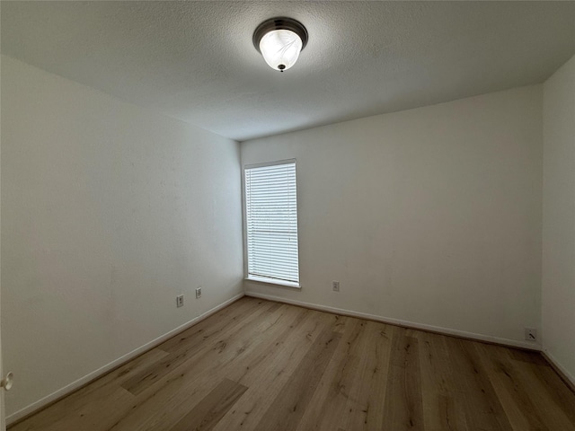 5711 Sugar Hill Dr Unit 62, Houston, TX 77057 - empty room with baseboards and light wood-style floors