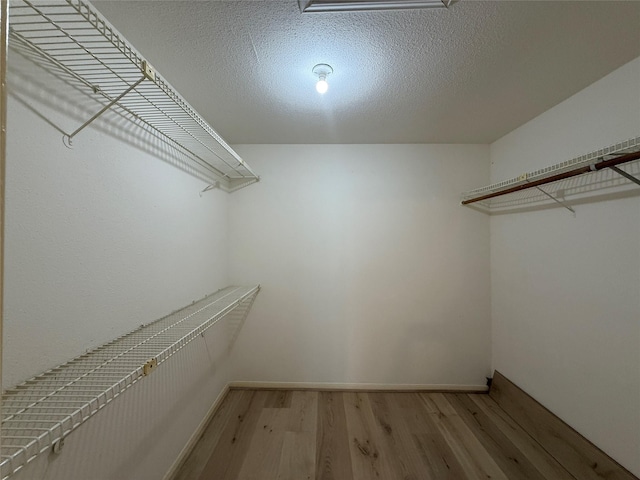 5711 Sugar Hill Dr Unit 62, Houston, TX 77057 - spacious closet featuring light wood finished floors