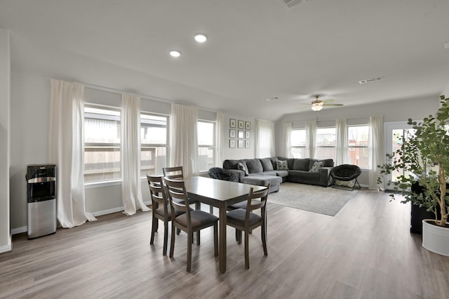 dining room featuring recessed lighting, wood finished floors, visible vents, a ceiling fan, and baseboards