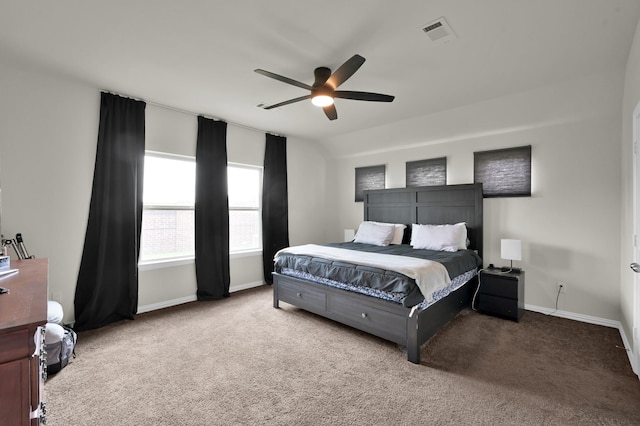 carpeted bedroom with baseboards, a ceiling fan, and visible vents