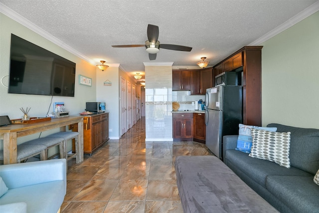 6102 Seawall Blvd Unit 155, Galveston, TX 77551 - living room with marble finish floor, a textured ceiling, crown molding, and a ceiling fan