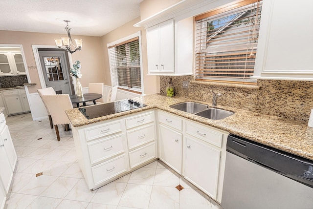 kitchen with a sink, tasteful backsplash, a notable chandelier, black electric stovetop, and dishwasher