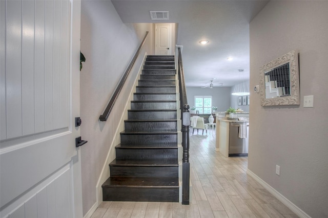 279 Capetown, Conroe, TX 77356 - staircase featuring wood finished floors, baseboards, and ceiling fan