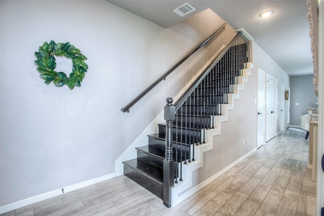 279 Capetown, Conroe, TX 77356 - stairway featuring wood finished floors and baseboards