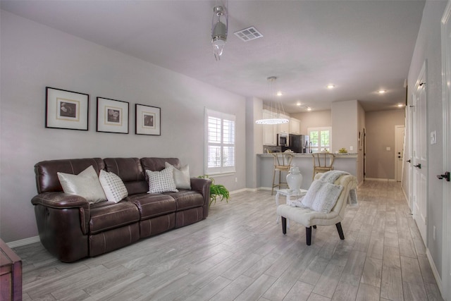279 Capetown, Conroe, TX 77356 - living room featuring light wood-style floors, baseboards, and recessed lighting