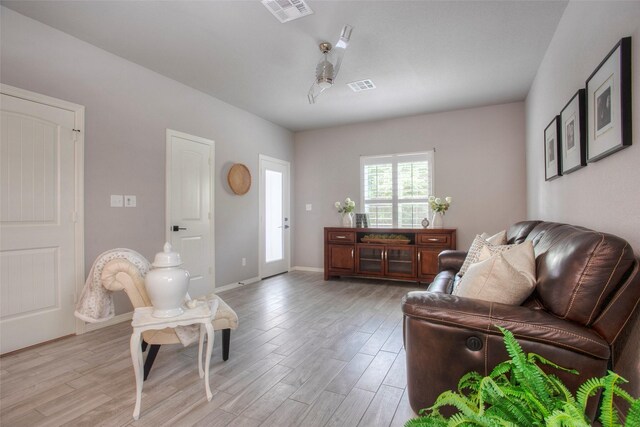 279 Capetown, Conroe, TX 77356 - living area featuring light wood finished floors and baseboards