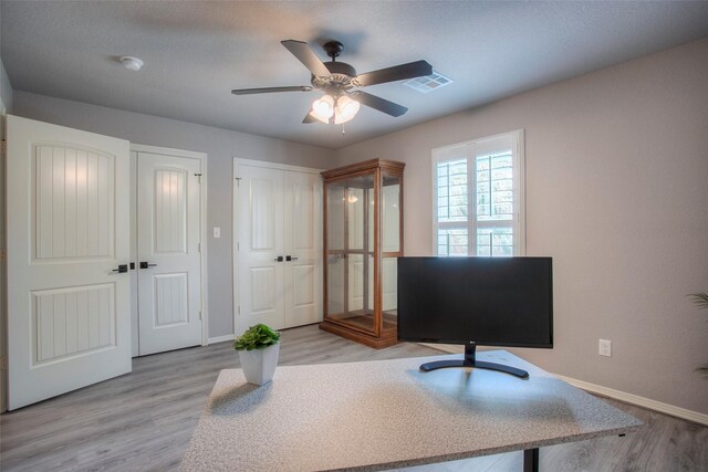 279 Capetown, Conroe, TX 77356 - office featuring baseboards, a ceiling fan, and light wood-style floors
