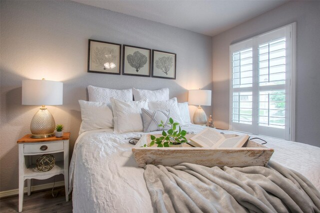 279 Capetown, Conroe, TX 77356 - bedroom featuring wood finished floors and baseboards