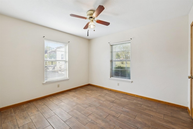 5233 N US Highway 183, Gonzales, TX 78629 - spare room with ceiling fan, baseboards, and wood finished floors