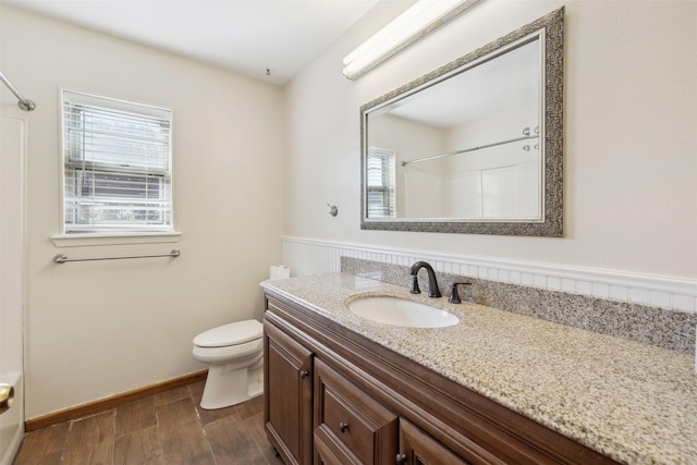 5233 N US Highway 183, Gonzales, TX 78629 - full bathroom featuring walk in shower, wood finished floors, vanity, and toilet