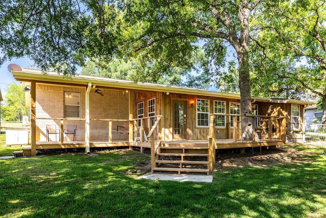 5233 N US Highway 183, Gonzales, TX 78629 - rear view of property with brick siding, a yard, and a deck