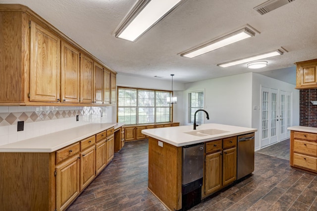 27 Westwood Dr W, Trinity, TX 75862 - kitchen featuring a sink, dark wood-style floors, a textured ceiling, dishwasher, and light countertops