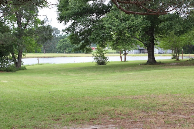 27 Westwood Dr W, Trinity, TX 75862 - view of green lawn featuring a water view and view of golf course