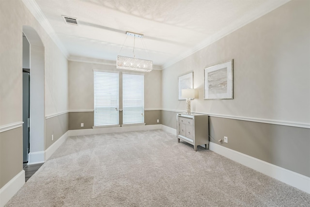 12107 Allington Cove Ln, Humble, TX 77346 - unfurnished room with arched walkways, baseboards, visible vents, crown molding, and carpet floors