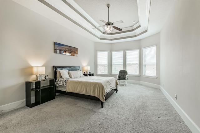12107 Allington Cove Ln, Humble, TX 77346 - carpeted bedroom with ceiling fan, baseboards, a raised ceiling, and crown molding