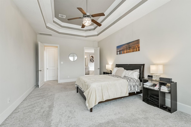 12107 Allington Cove Ln, Humble, TX 77346 - bedroom with a tray ceiling, visible vents, baseboards, and light carpet