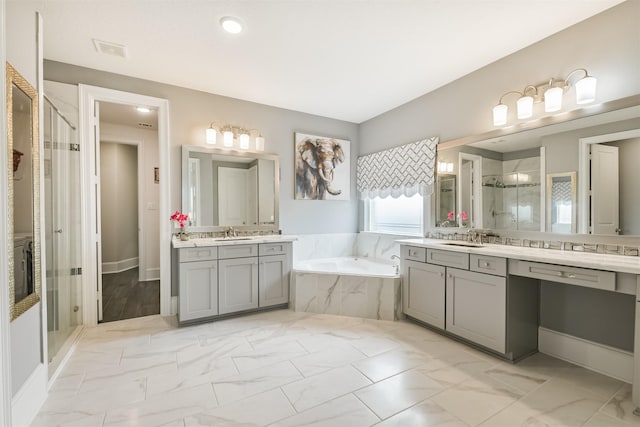 12107 Allington Cove Ln, Humble, TX 77346 - bathroom featuring a shower stall, a garden tub, a sink, and visible vents