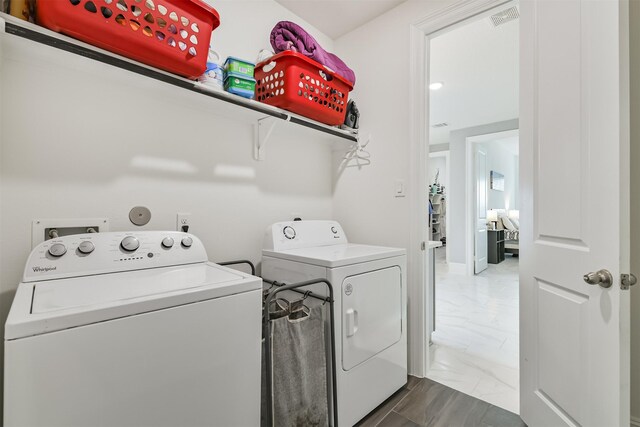 12107 Allington Cove Ln, Humble, TX 77346 - washroom with washing machine and dryer, marble finish floor, and laundry area
