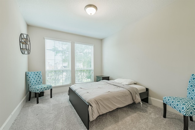 12107 Allington Cove Ln, Humble, TX 77346 - carpeted bedroom featuring baseboards and multiple windows