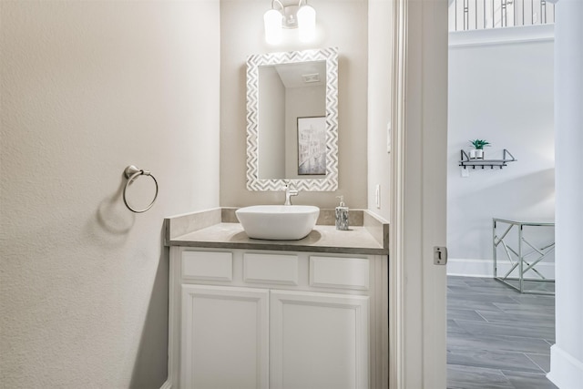 12107 Allington Cove Ln, Humble, TX 77346 - bathroom featuring visible vents, baseboards, and vanity