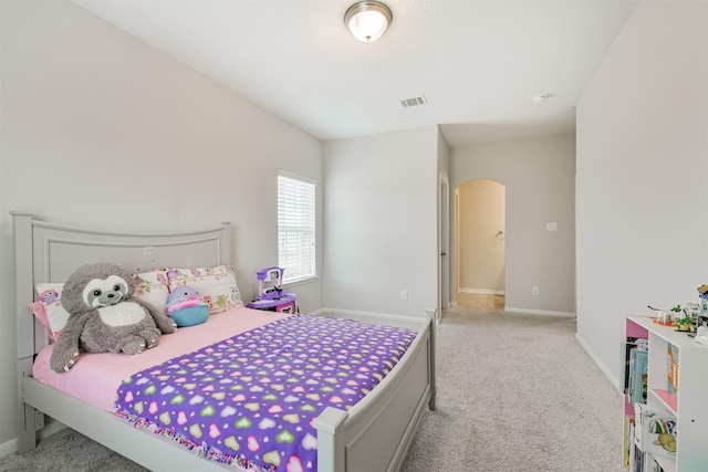 12107 Allington Cove Ln, Humble, TX 77346 - carpeted bedroom with arched walkways, visible vents, and baseboards