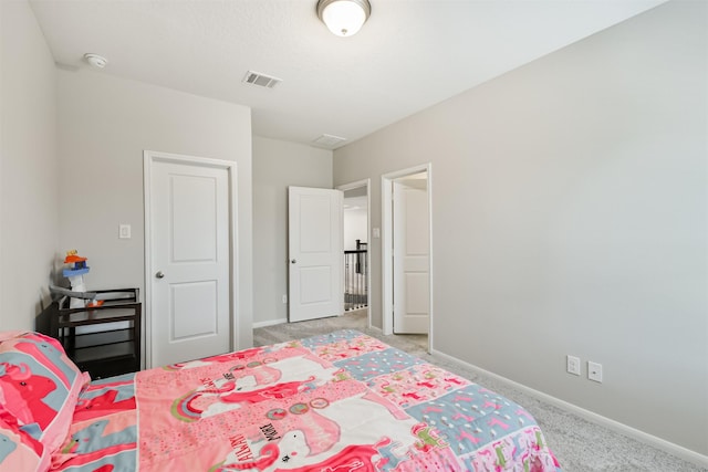 12107 Allington Cove Ln, Humble, TX 77346 - bedroom featuring light colored carpet, baseboards, and visible vents