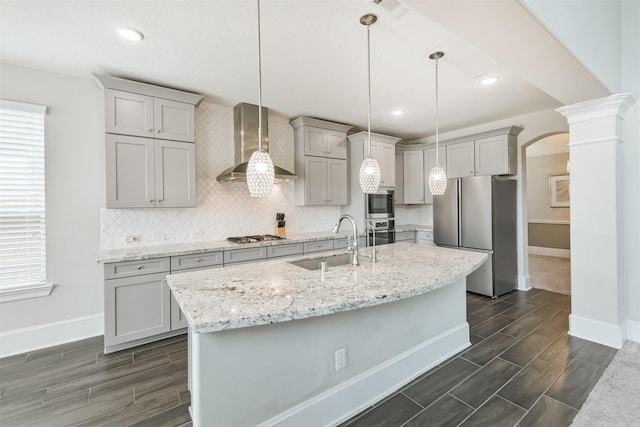 12107 Allington Cove Ln, Humble, TX 77346 - kitchen with stainless steel appliances, gray cabinets, a sink, wall chimney exhaust hood, and baseboards