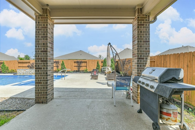 12107 Allington Cove Ln, Humble, TX 77346 - view of patio / terrace with a fenced backyard, a fenced in pool, and a grill