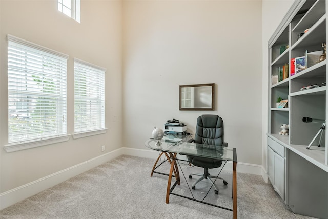 12107 Allington Cove Ln, Humble, TX 77346 - office space with baseboards, a towering ceiling, and light carpet