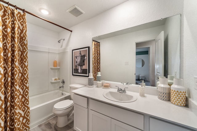 1200 Haverford Ln, Dayton, TX 77535 - bathroom featuring vanity, a textured wall, visible vents, toilet, and shower / bath combo with shower curtain