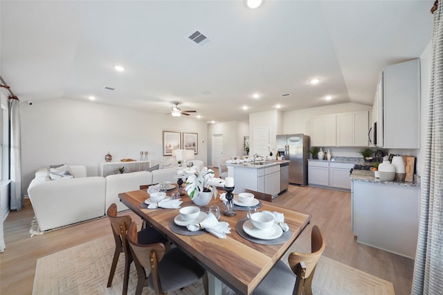 804 Timmons Ln, Dayton, TX 77535 - dining area featuring recessed lighting, lofted ceiling, visible vents, a ceiling fan, and light wood-style flooring