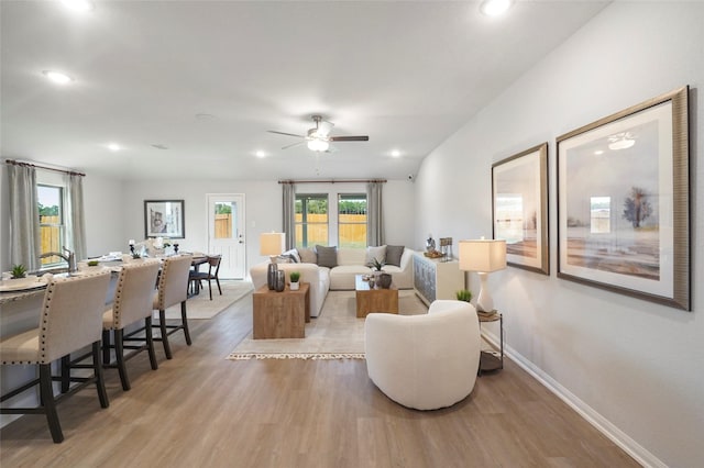 804 Timmons Ln, Dayton, TX 77535 - living room with ceiling fan, baseboards, light wood finished floors, and recessed lighting