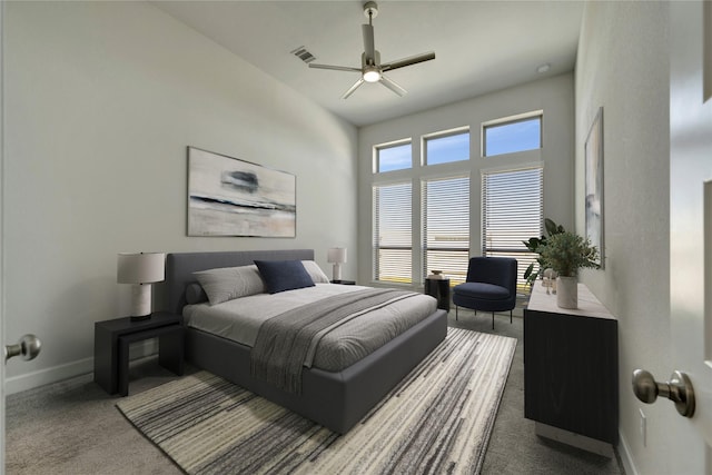 bedroom featuring carpet flooring, baseboards, visible vents, and ceiling fan