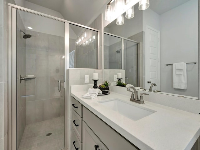 bathroom featuring vanity and a stall shower