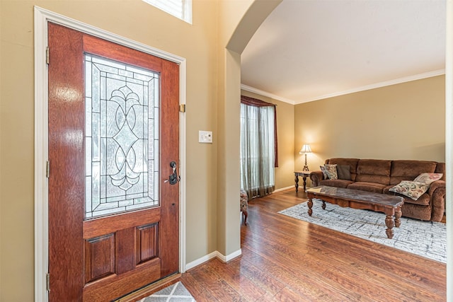 11906 Canyon Valley Dr, Tomball, TX 77377 - foyer featuring baseboards, arched walkways, wood finished floors, and a wealth of natural light