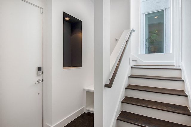 stairs featuring baseboards