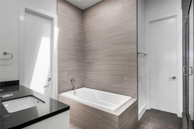 bathroom featuring a bath, a shower stall, and vanity