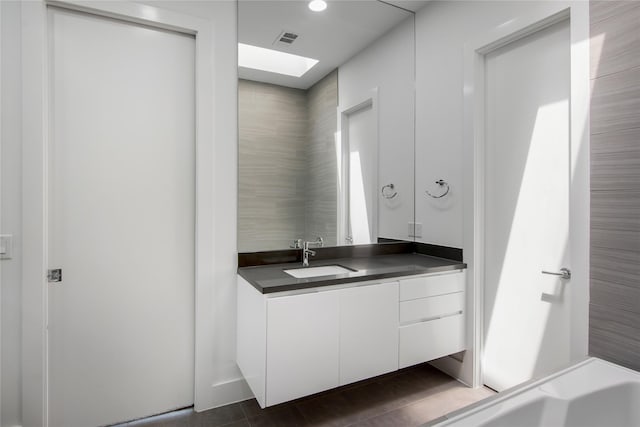 1155 W 18th St, Houston, TX 77008 - bathroom with a skylight and vanity