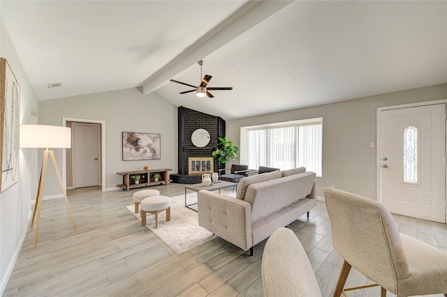 17434 Jolly Boat Dr, Crosby, TX 77532 - living room featuring light wood-style flooring, baseboards, a fireplace, and a ceiling fan