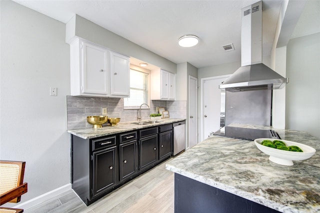 17434 Jolly Boat Dr, Crosby, TX 77532 - kitchen featuring wall chimney range hood, a sink, dishwasher, white cabinets, and light wood-style flooring