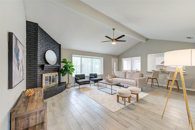 17434 Jolly Boat Dr, Crosby, TX 77532 - living room featuring ceiling fan, light wood-type flooring, healthy amount of natural light, and a fireplace