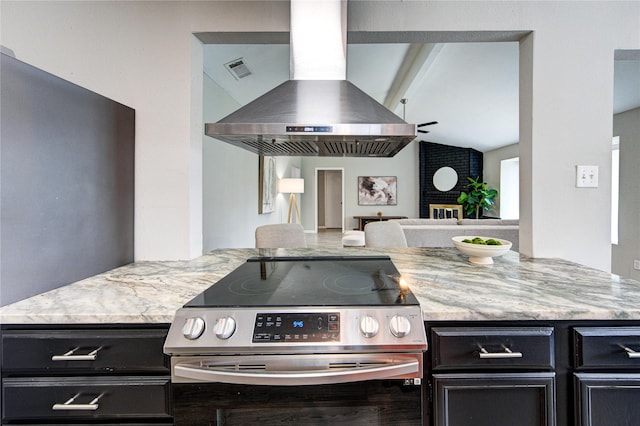 17434 Jolly Boat Dr, Crosby, TX 77532 - kitchen featuring stainless steel appliances, exhaust hood, dark cabinets, open floor plan, and light stone countertops