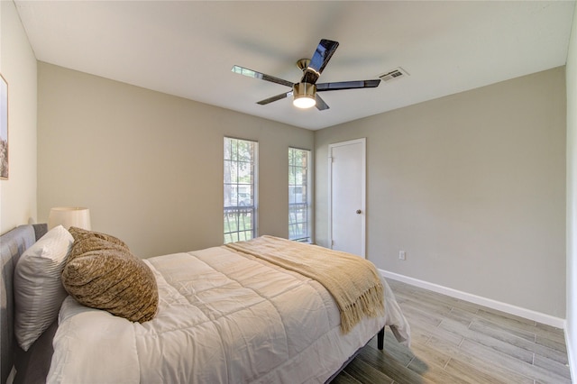 17434 Jolly Boat Dr, Crosby, TX 77532 - bedroom with light wood-style flooring, baseboards, and ceiling fan