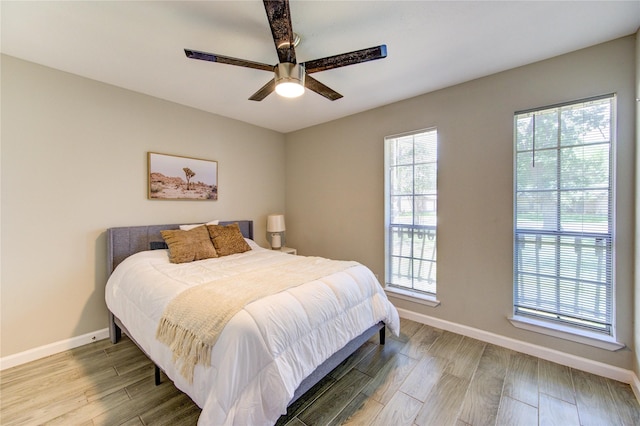 17434 Jolly Boat Dr, Crosby, TX 77532 - bedroom featuring baseboards, wood finished floors, and ceiling fan
